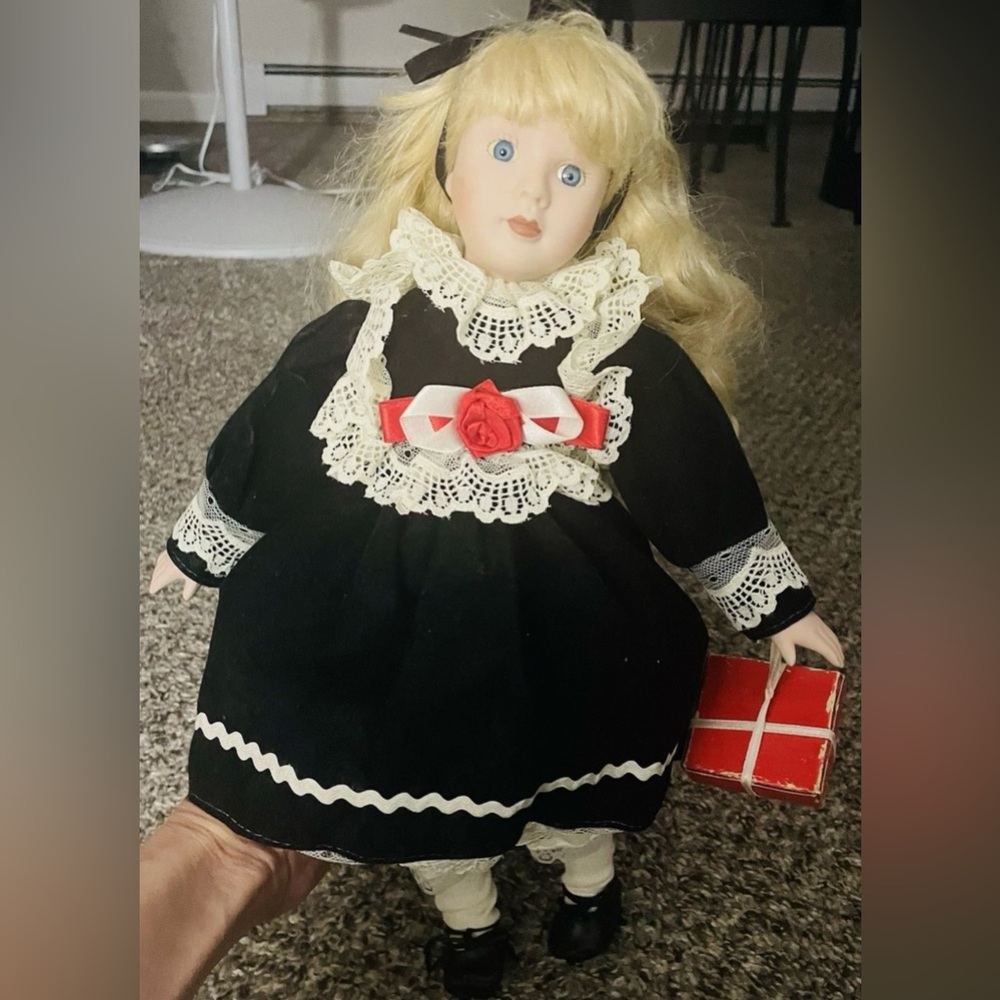 VINTAGE Christmas Porcelain Doll with Black dress, white lace and red accents.